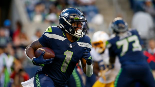 NFL: Los Angeles Chargers at Seattle Seahawks Aug 28, 2021; Seattle, Washington, USA; Seattle Seahawks wide receiver D'Wayne Eskridge (1) runs the ball against the Los Angeles Chargers during the first quarter at Lumen Field. Mandatory Credit: Joe Nicholson-USA TODAY Sports